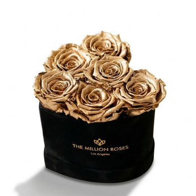 Black box with gold logo containing dried gold roses, elegant home decor for special occasions, SKU: 01112000149021